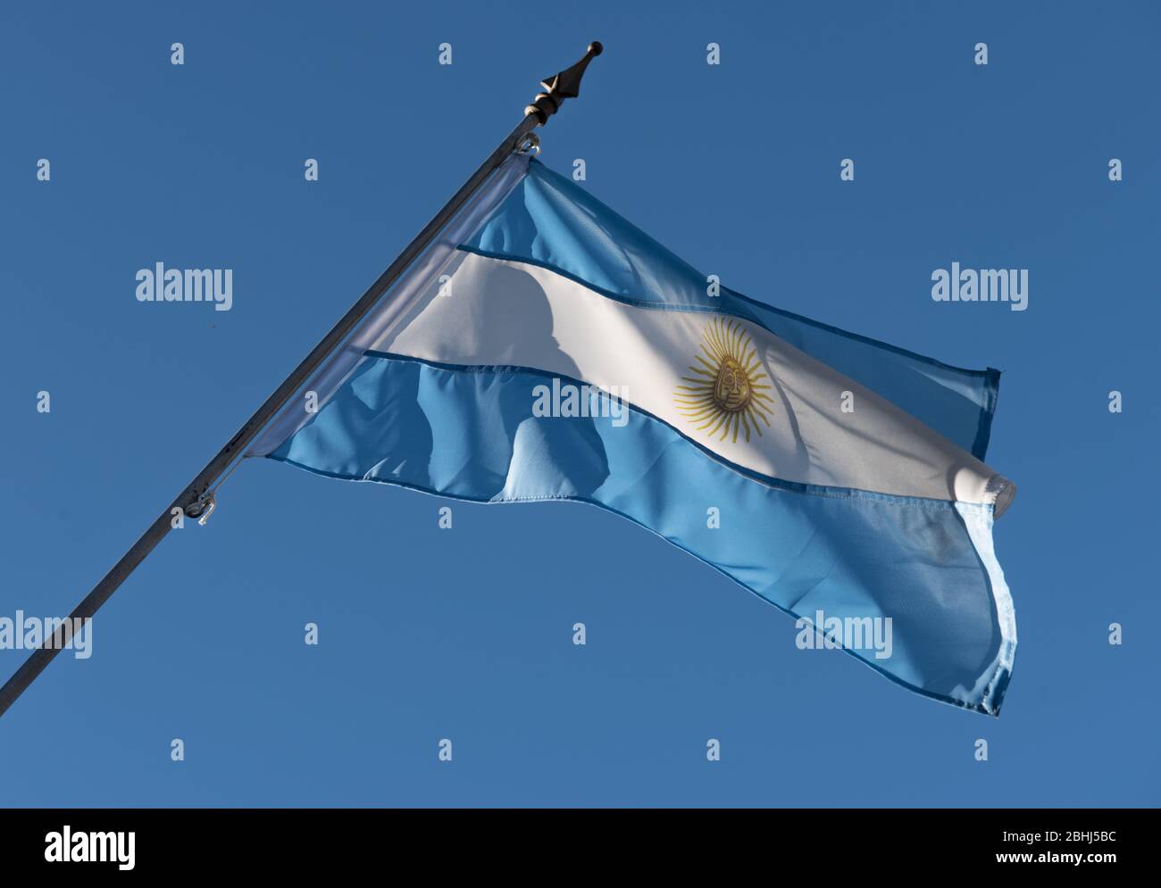 Argentinian on a blue sky and fluttering in the wind Stock Photo