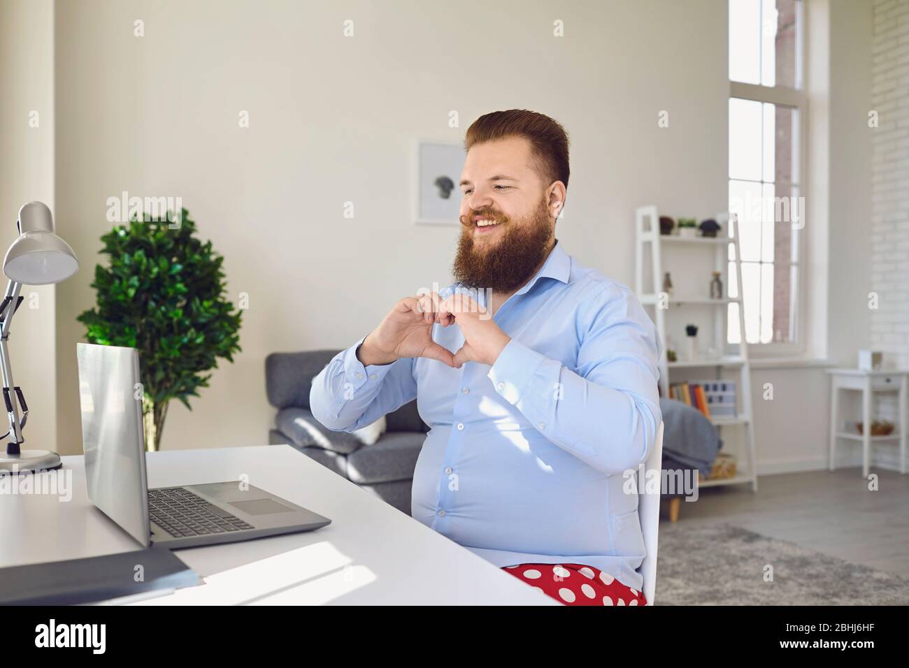 Online dating chat video chat call. Funny fat bearded man communicates video  call while sitting at home Stock Photo - Alamy