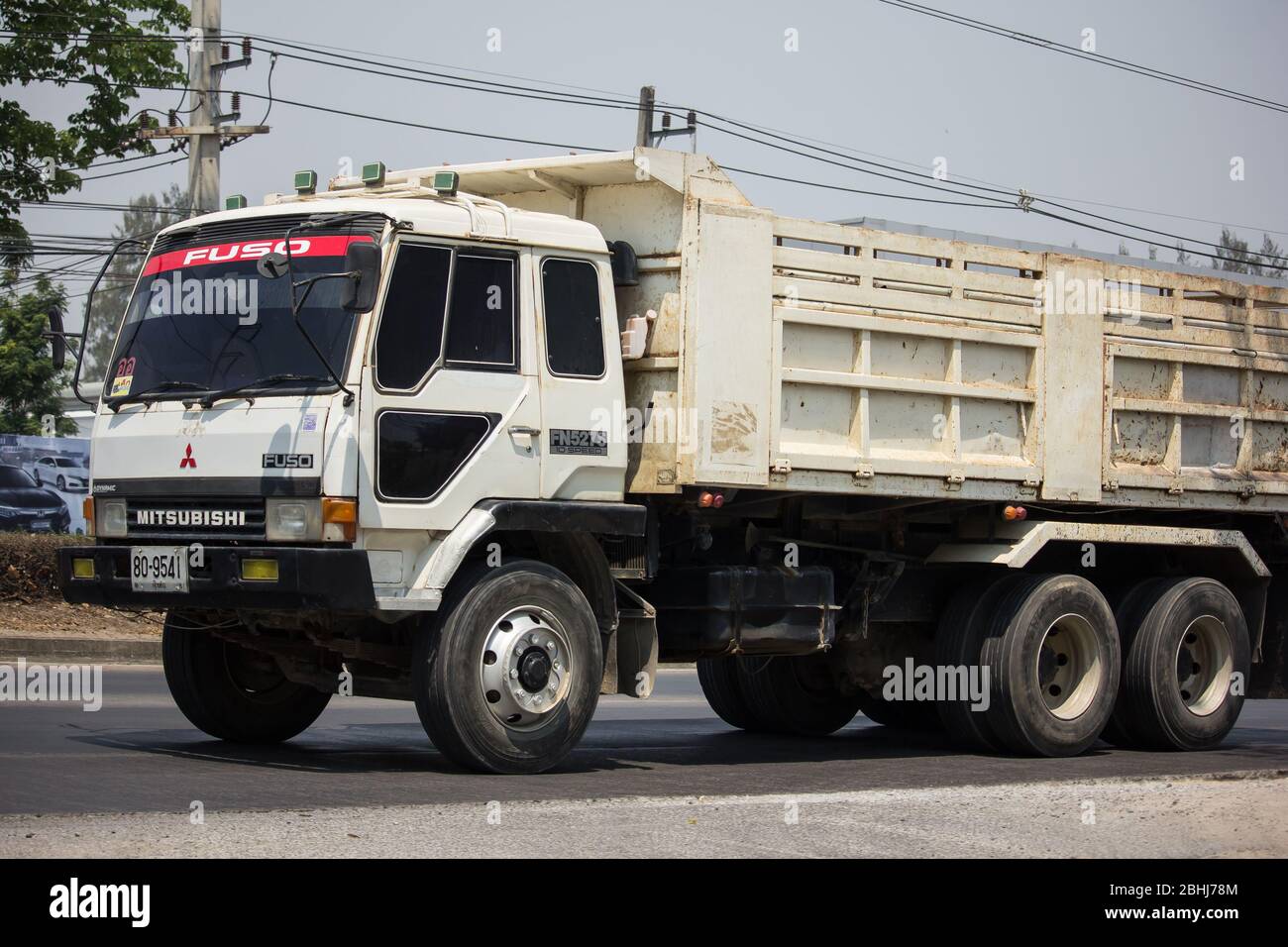 Chiangmai, Thailand - March  24 2020:  Private Mitsubishi Fuso  Dump Truck.  Photo at road no.121 about 8 km from downtown Chiangmai, thailand. Stock Photo