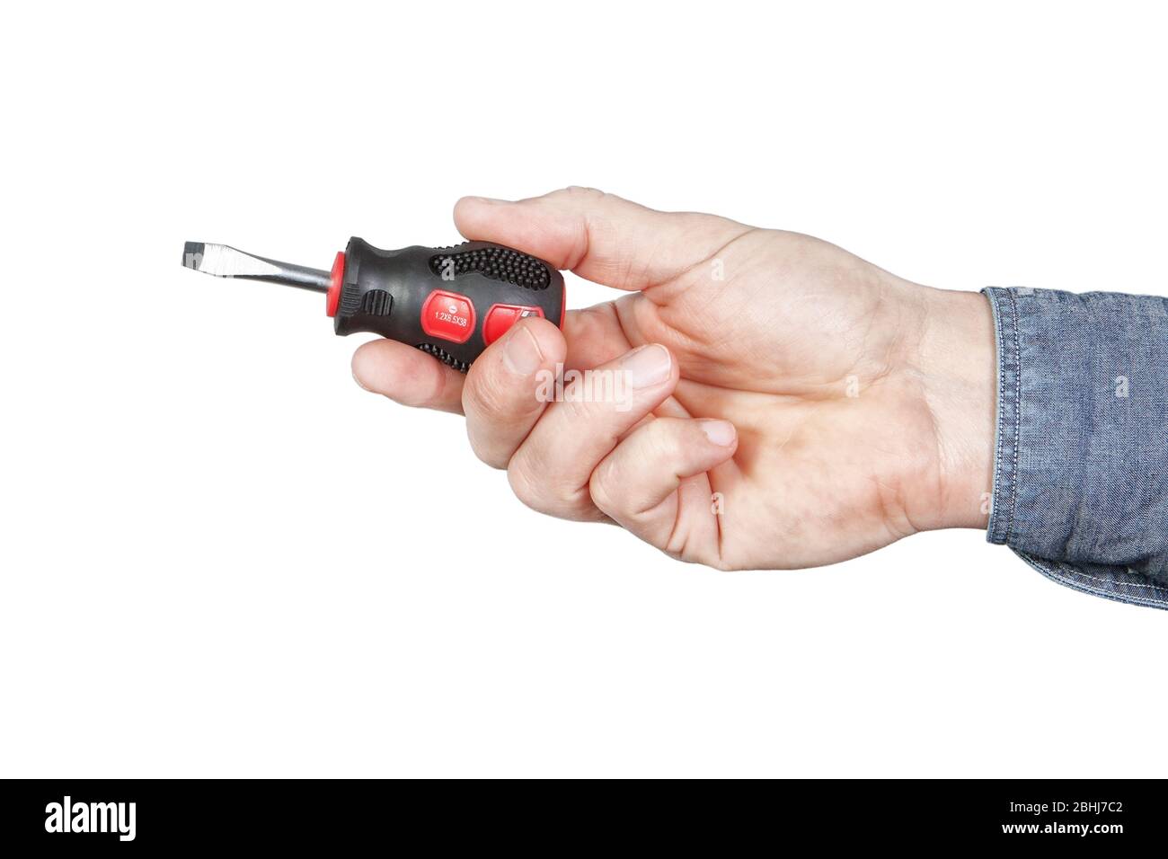 A small screwdriver in his hand. On a white background. Stock Photo