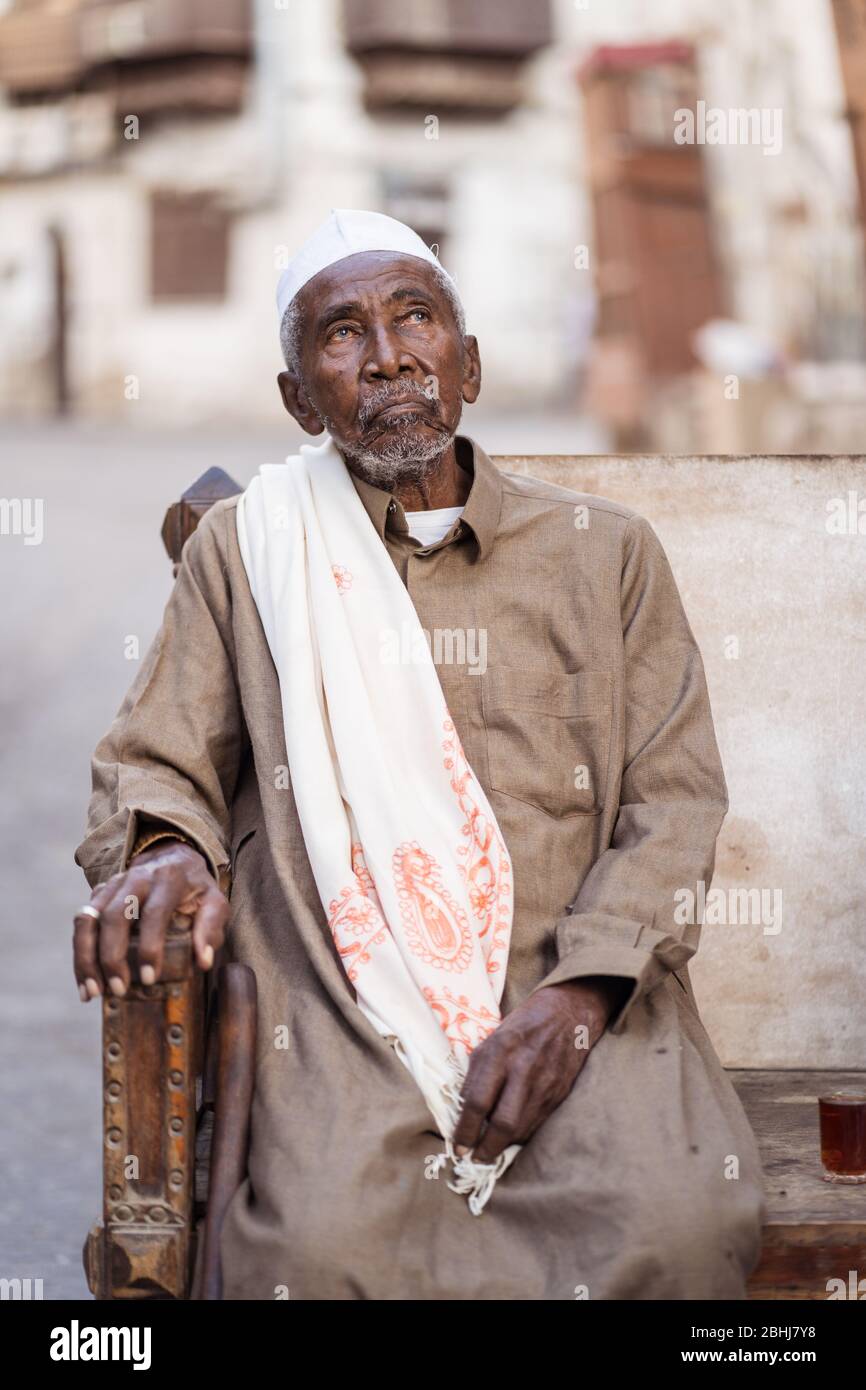 Jeddah / Saudi Arabia - January 16, 2020: portrait of famous traditional carpenter in Al-Balad drinking tea in the streets of downtown Jeddah Stock Photo