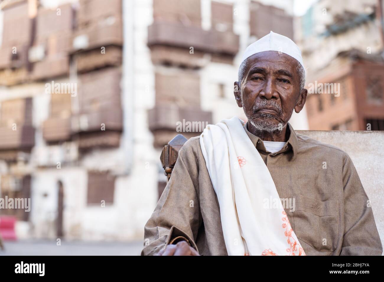 Jeddah / Saudi Arabia - January 16, 2020: portrait of famous traditional carpenter in Al-Balad drinking tea in the streets of downtown Jeddah Stock Photo