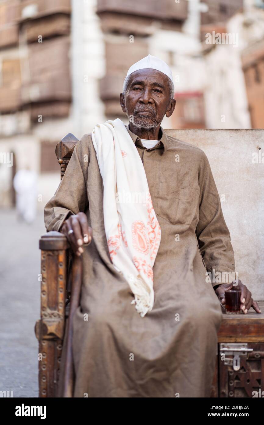 Jeddah / Saudi Arabia - January 16, 2020: portrait of famous traditional carpenter in Al-Balad drinking tea in the streets of downtown Jeddah Stock Photo