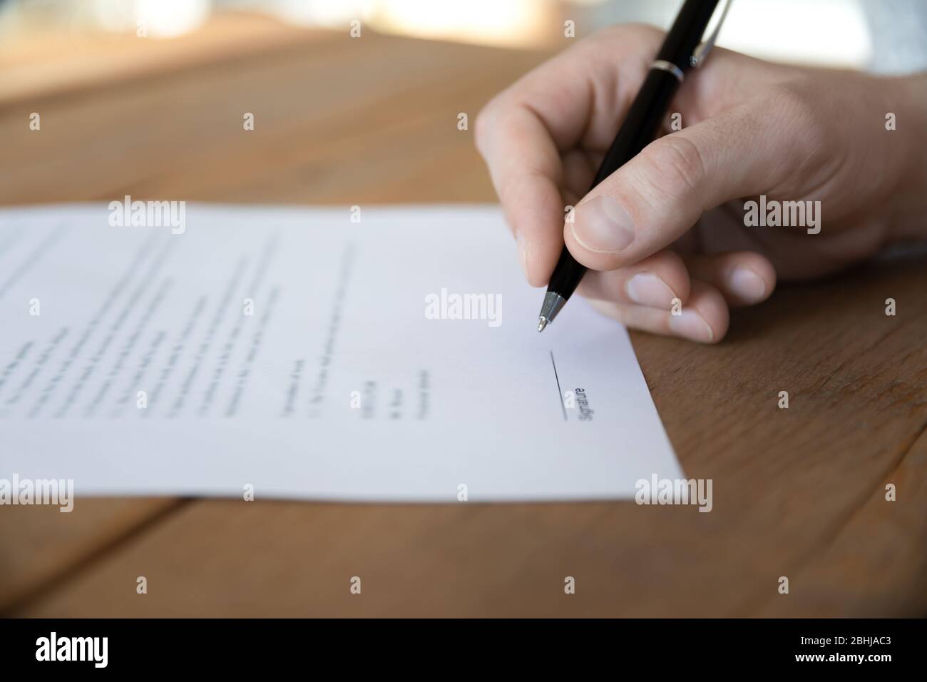 Close up male hand holding pen, prepare to signing contract Stock Photo ...