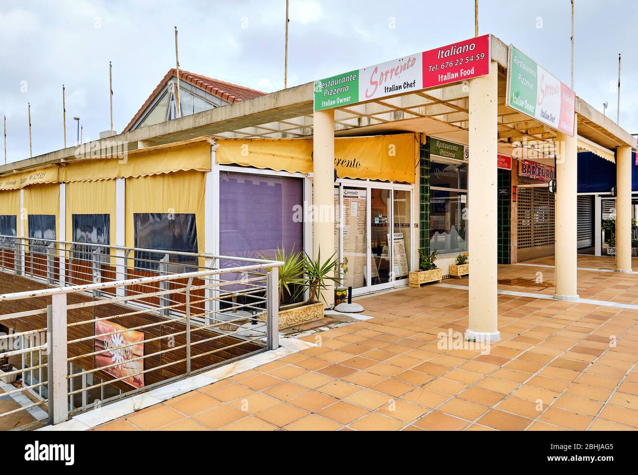 Orihuela, Spain - April 16, 2020: Closed bars restaurants shopping mall commercial area due to corona virus pandemic outbreak Stock Photo