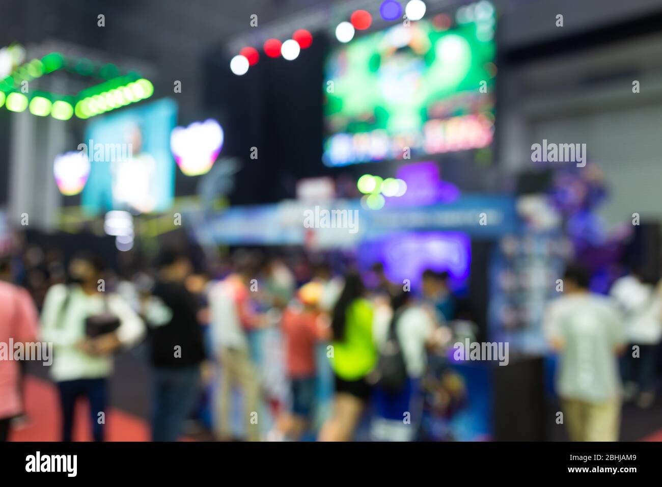 Abstract blur people in exhibition hall event computer game show festival background. Stock Photo