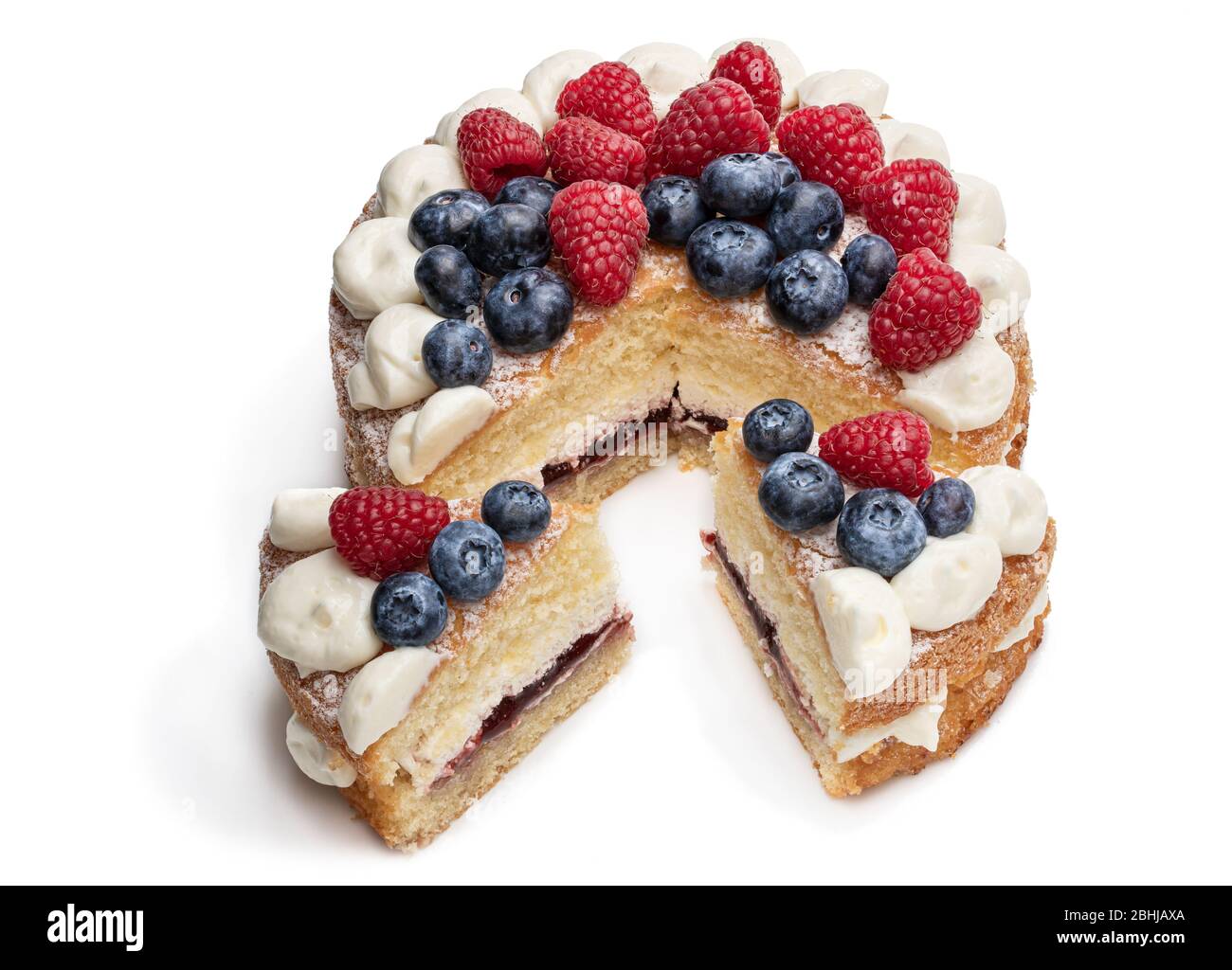 Victoria sponge cake with whipped cream and berries on top isolated on