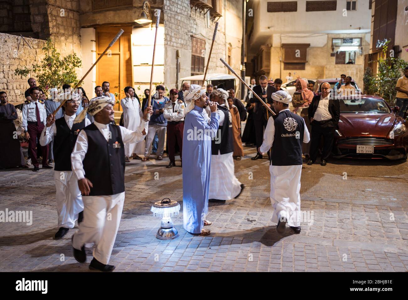 Jeddah / Saudi Arabia - January 16, 2020: arab and saudi men celebrate a tradicional dance with music in the streets of Al-Balad historic downtown Stock Photo