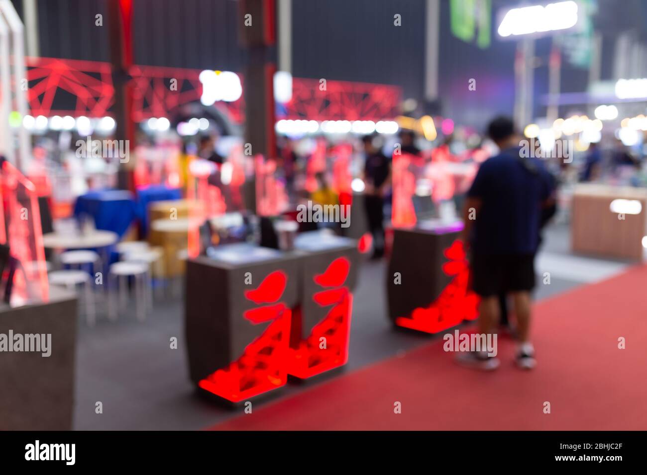 Abstract blur people in exhibition hall event computer game show festival background. Stock Photo