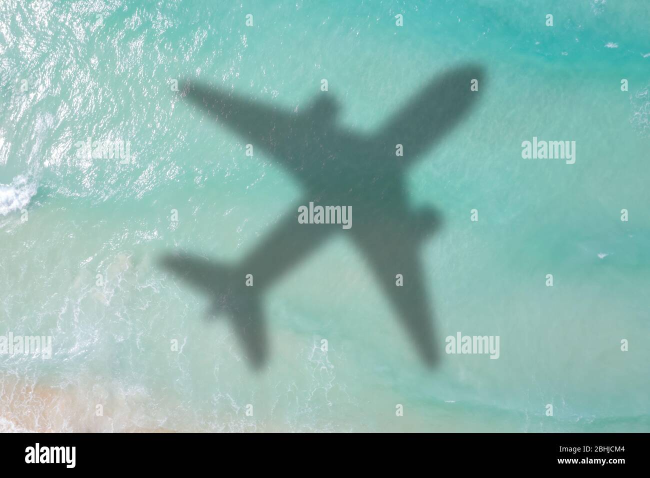 Symbolic picture vacation travel traveling sea airplane flying Seychelles aerial photo waves Stock Photo