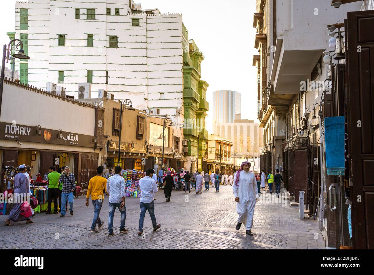 Jeddah / Saudi Arabia - January 16, 2020: People walking in the streets of historic Al-Balad UNESCO old town Stock Photo
