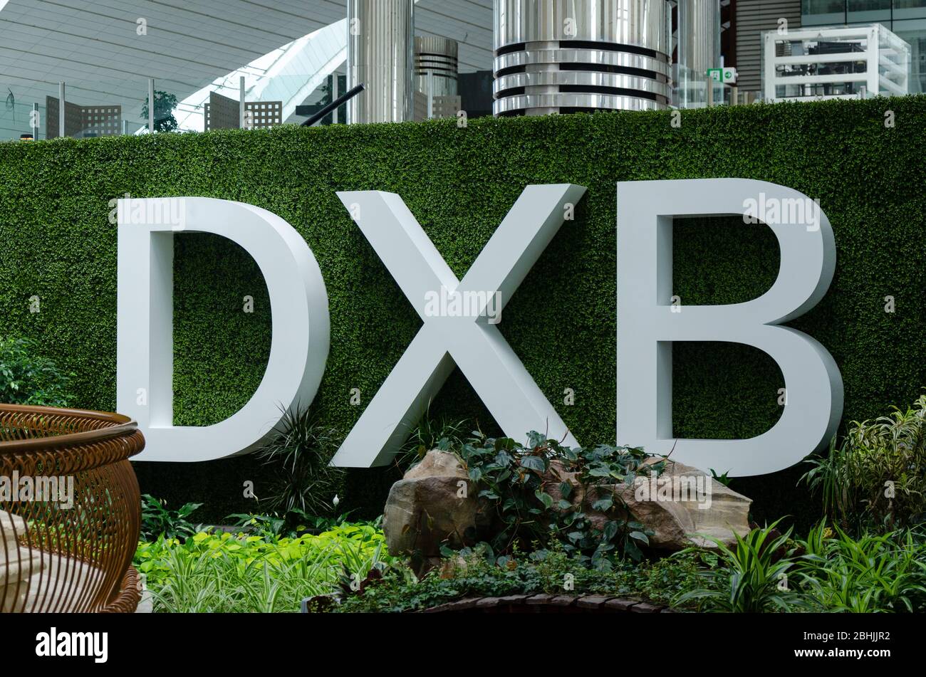 Board with DXB written in bold capital letters at Dubai International Airport Stock Photo