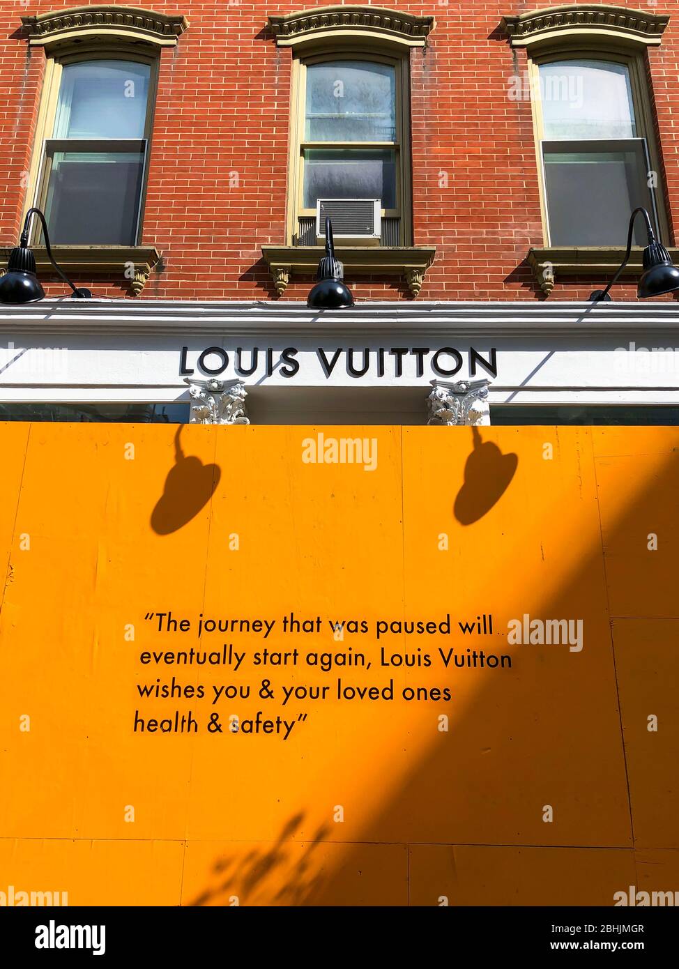 COVID-19 Affects to New York Business. Hopeful messages on the barricade  board at storefront of Louis Vuitton SOHO store in the Saturday afternoon  Stock Photo - Alamy
