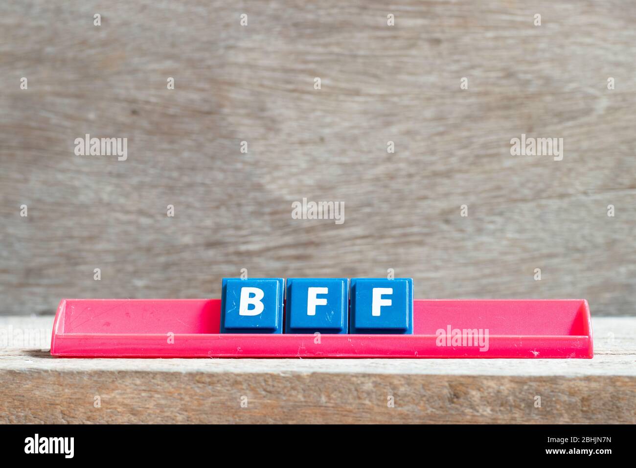 Tile letter on red rack in word BFF (Abbreviation of best friend
