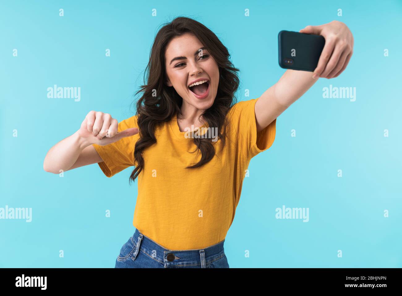 Image of emotional happy optimistic young pretty woman posing isolated ...