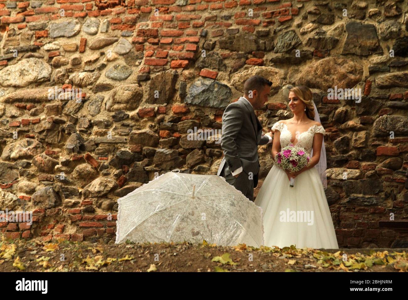 Bride and groom during a  photo-shoot in the picturesque Old Town of Sibiu, Romania Stock Photo