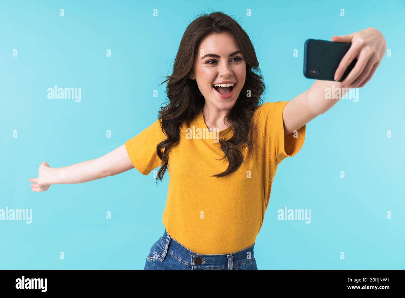 Image of emotional happy optimistic young pretty woman posing isolated ...