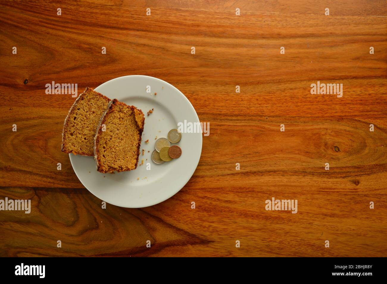 Rich Cake and Poor Money Stock Photo