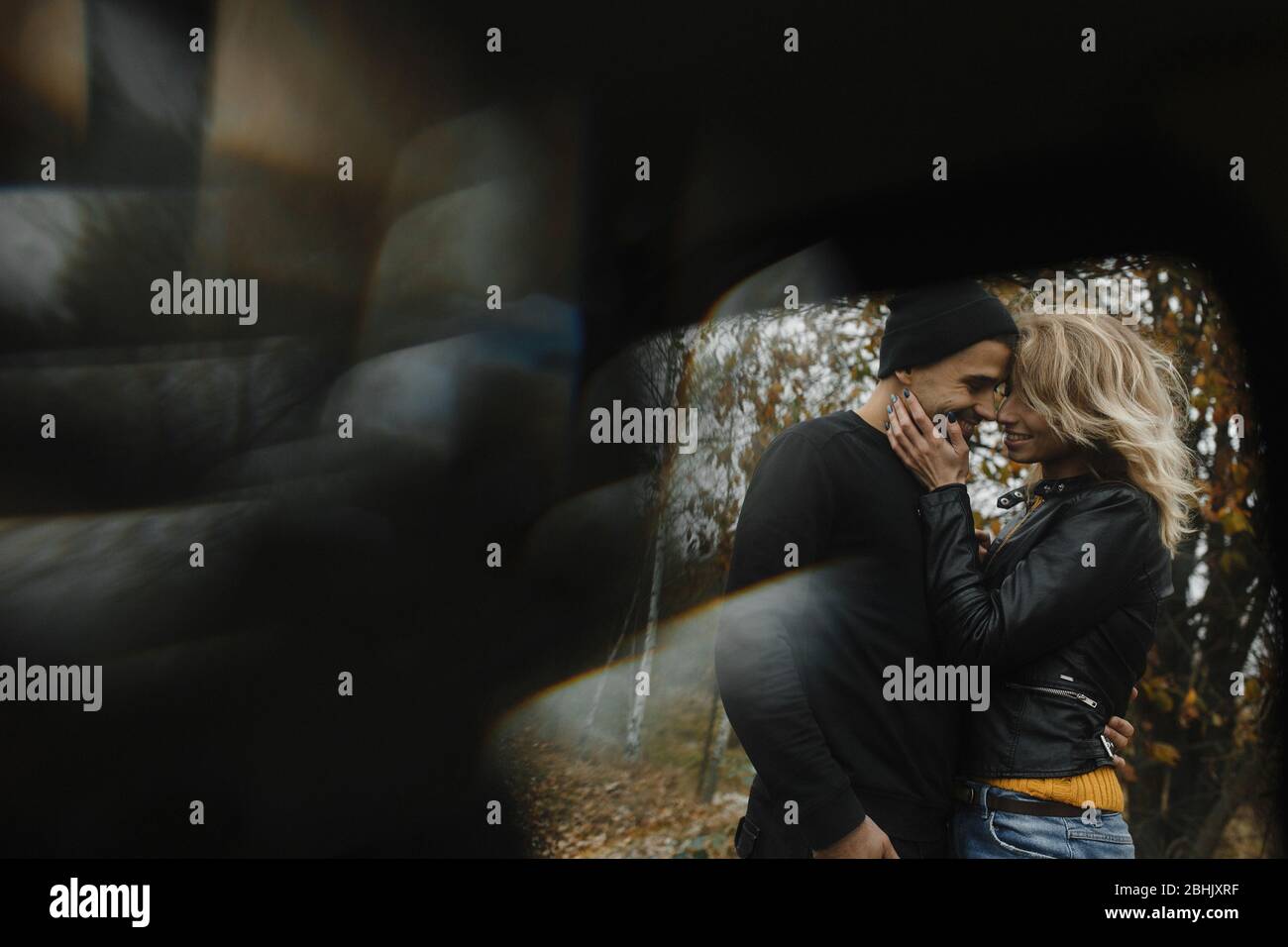 Woman and man standing close to each other and smiling Stock Photo - Alamy