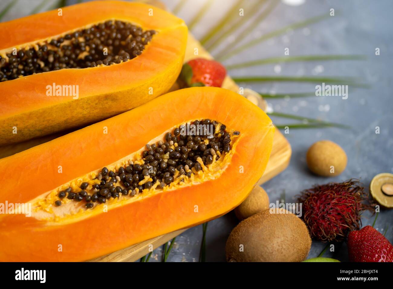 Papaya. Tropical Fruits. Close up shot of two halves of ripe papaya