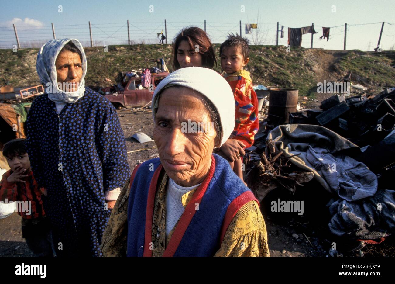 Roma family living in squalid conditions at the Vardarishte landfill site by the Vardar river in Skopje, Macedonia. The Roma have built shacks by the dump and rummage through the waste in which they live in, sometimes finding plastic or metal they can sell. Stock Photo