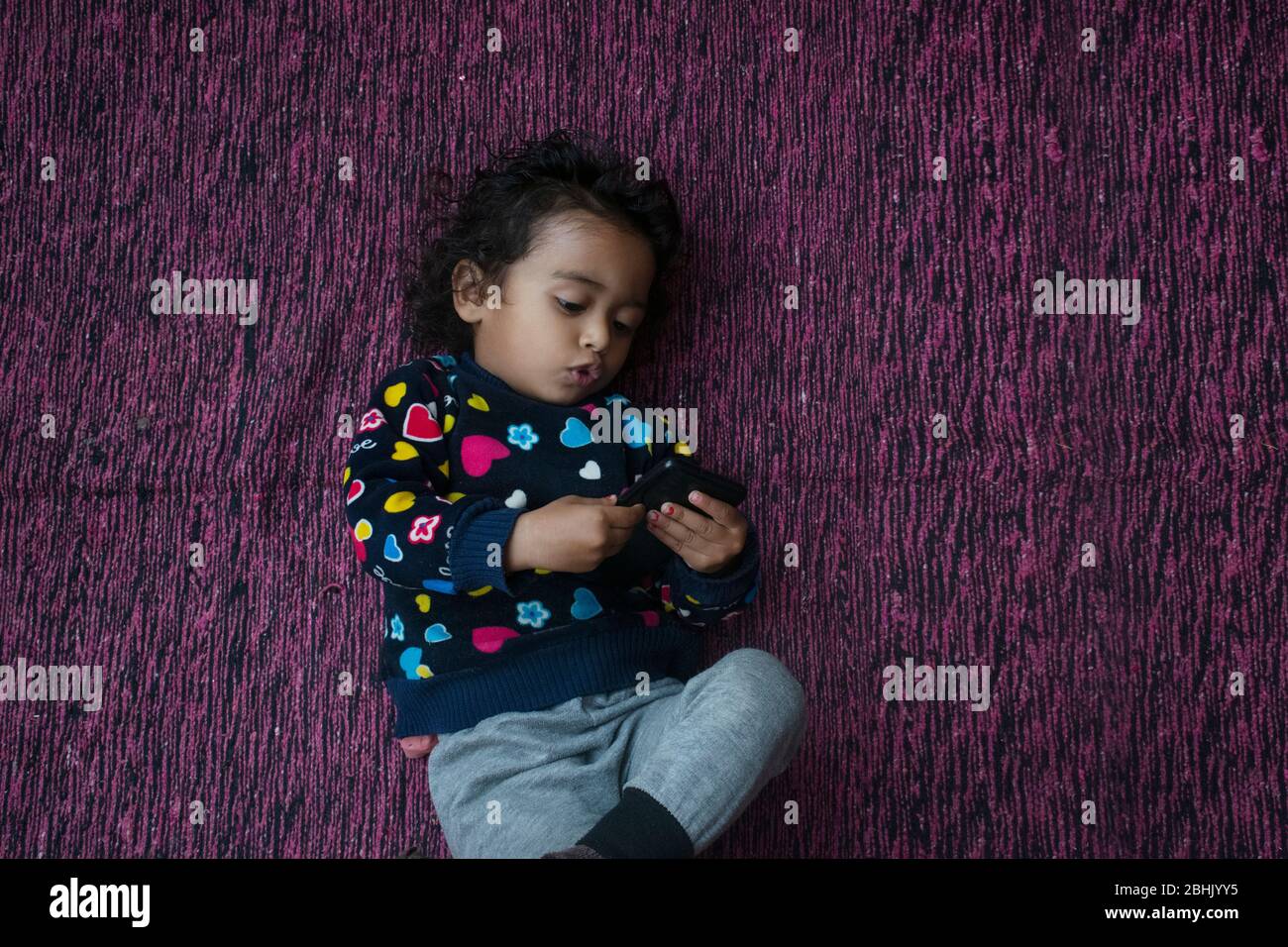 child using a mobile phone Stock Photo