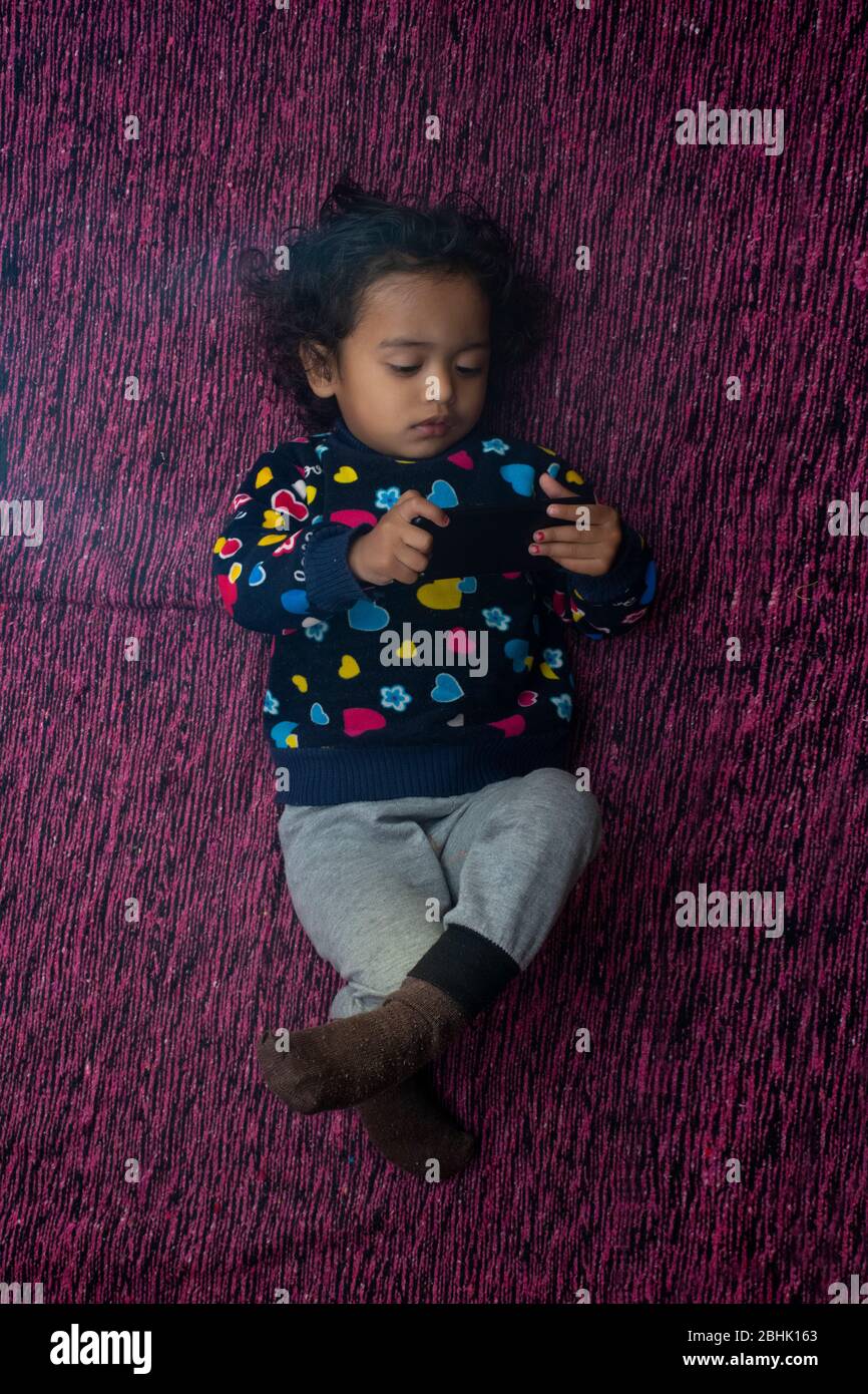 child using a mobile phone Stock Photo