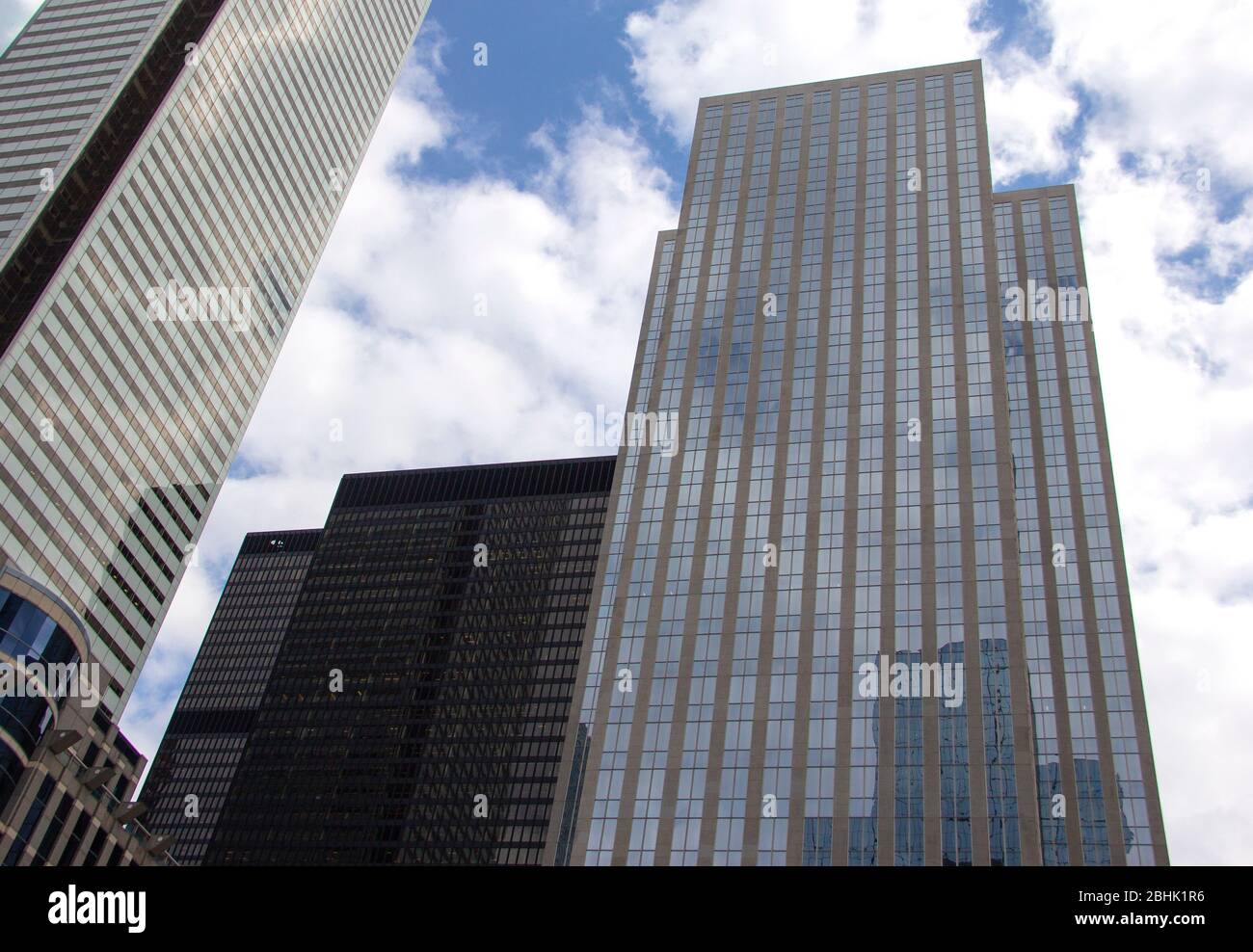 Skyscrapers reflecting cloudy skies Stock Photo - Alamy