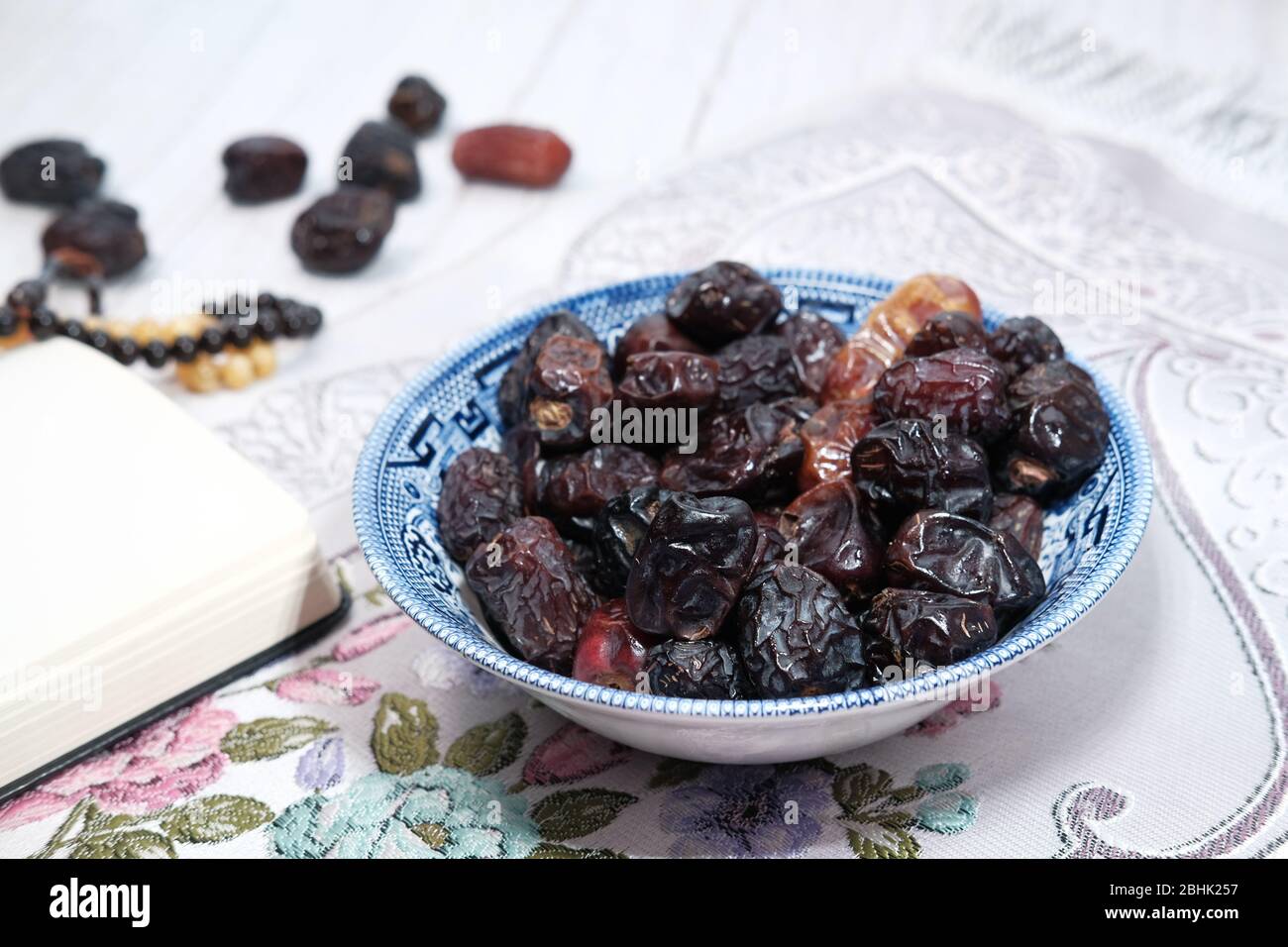 the concept of ramadan, close up of date fruit in a bowl Stock Photo