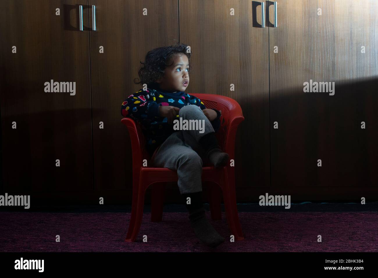 young child watching television Stock Photo