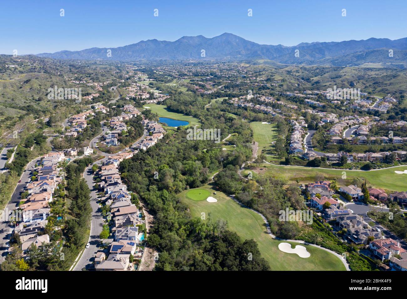 Aerial view above Coto De Caza gated community in the foothills of Orange County, California with Santiago Peak in the distance Stock Photo