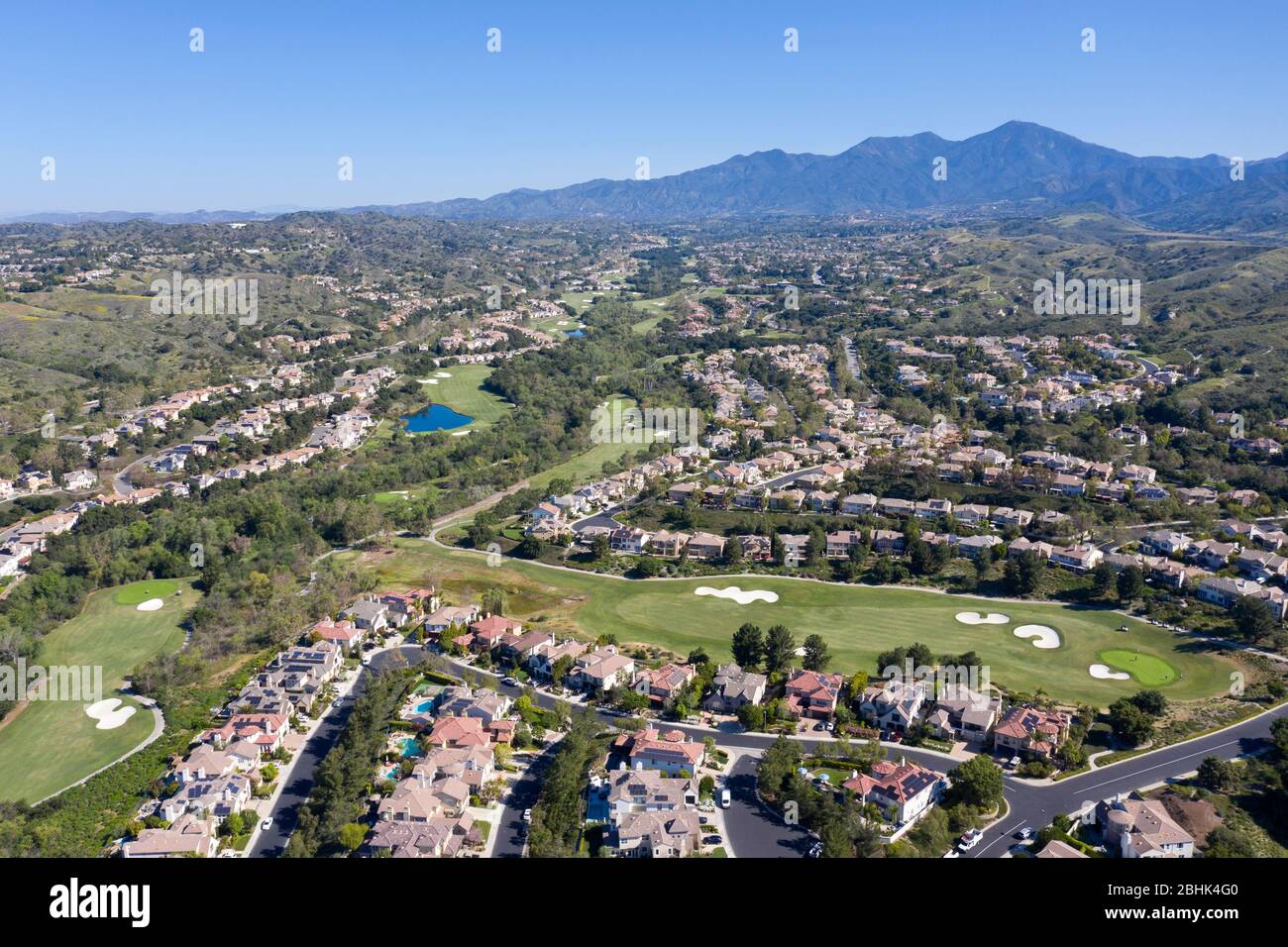 Aerial view above Coto De Caza gated community in the foothills of Orange County, California with Santiago Peak in the distance Stock Photo