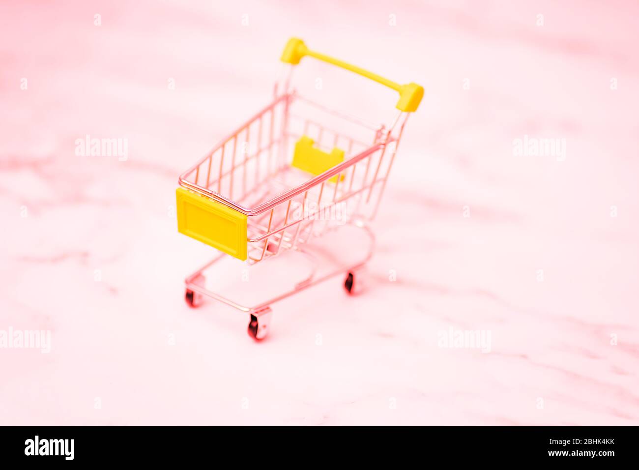 shopping cart. Copy space for text or design. Stainless steel shopping trolley upside down. Minimalist shopping concept. Stock Photo
