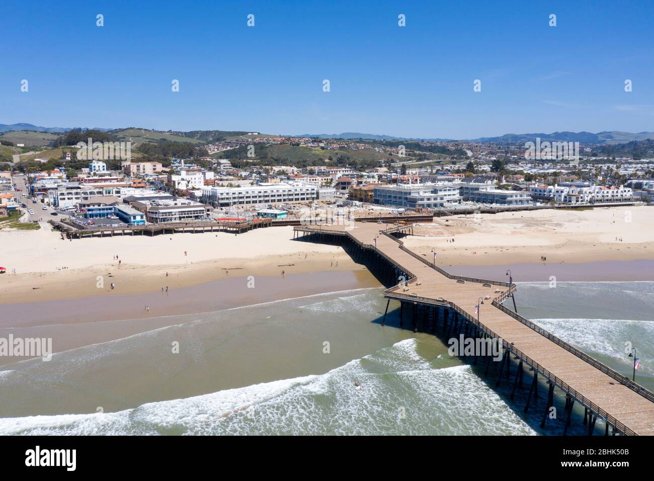 view of the Pismo Beach pier into the Pacific Ocean along the Central Coast of California Stock Photo