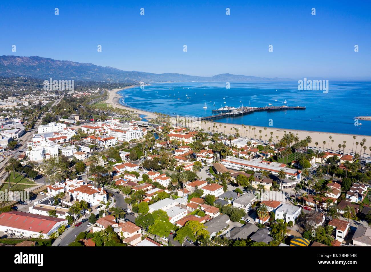 Aerial views above Santa Barbara with the beach and Stearns Wharf on a sunny clear day Stock Photo