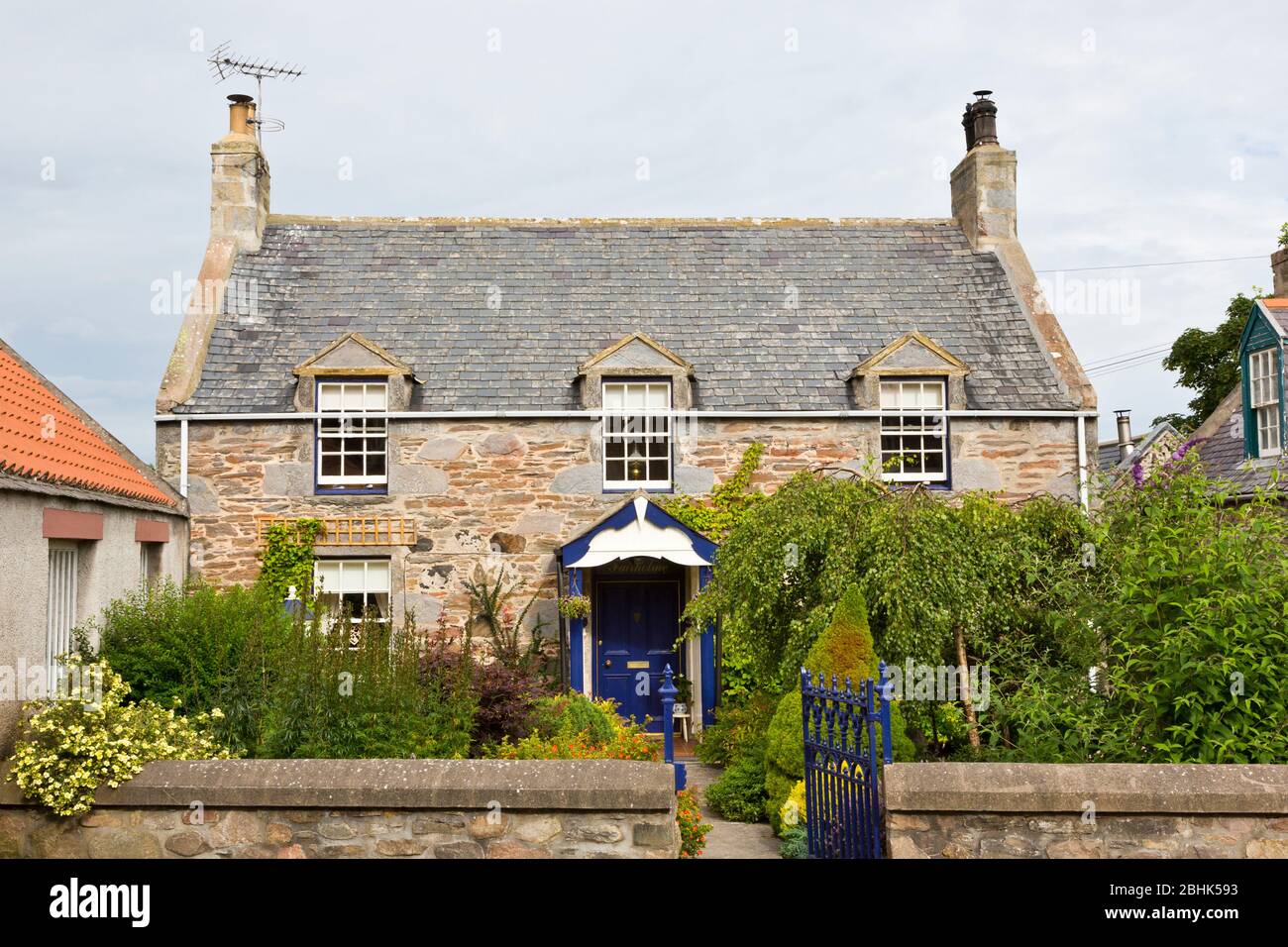 An attractive cottage in the historic village of Fordyce in Aberdeenshire Scotland Stock Photo