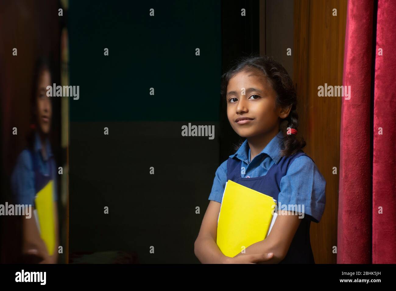 Portrait of a young school girl smiling Stock Photo - Alamy