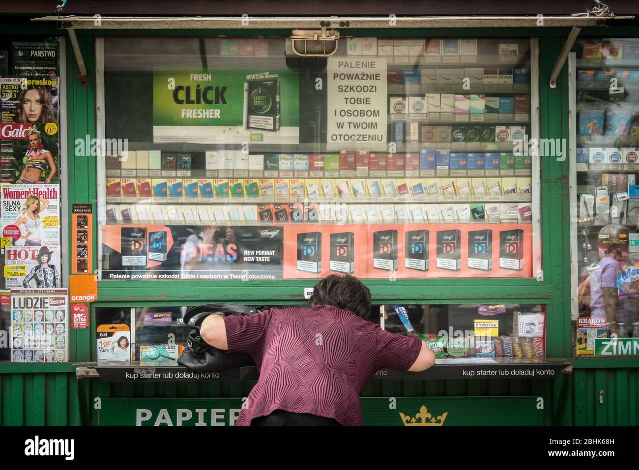 KRAKOW, POLAND - MAY 9, 2013: Woman discussing in front of a Trafika, a  typical kiosk from Poland selling basic needs, tobacco products and  cigarettes Stock Photo - Alamy