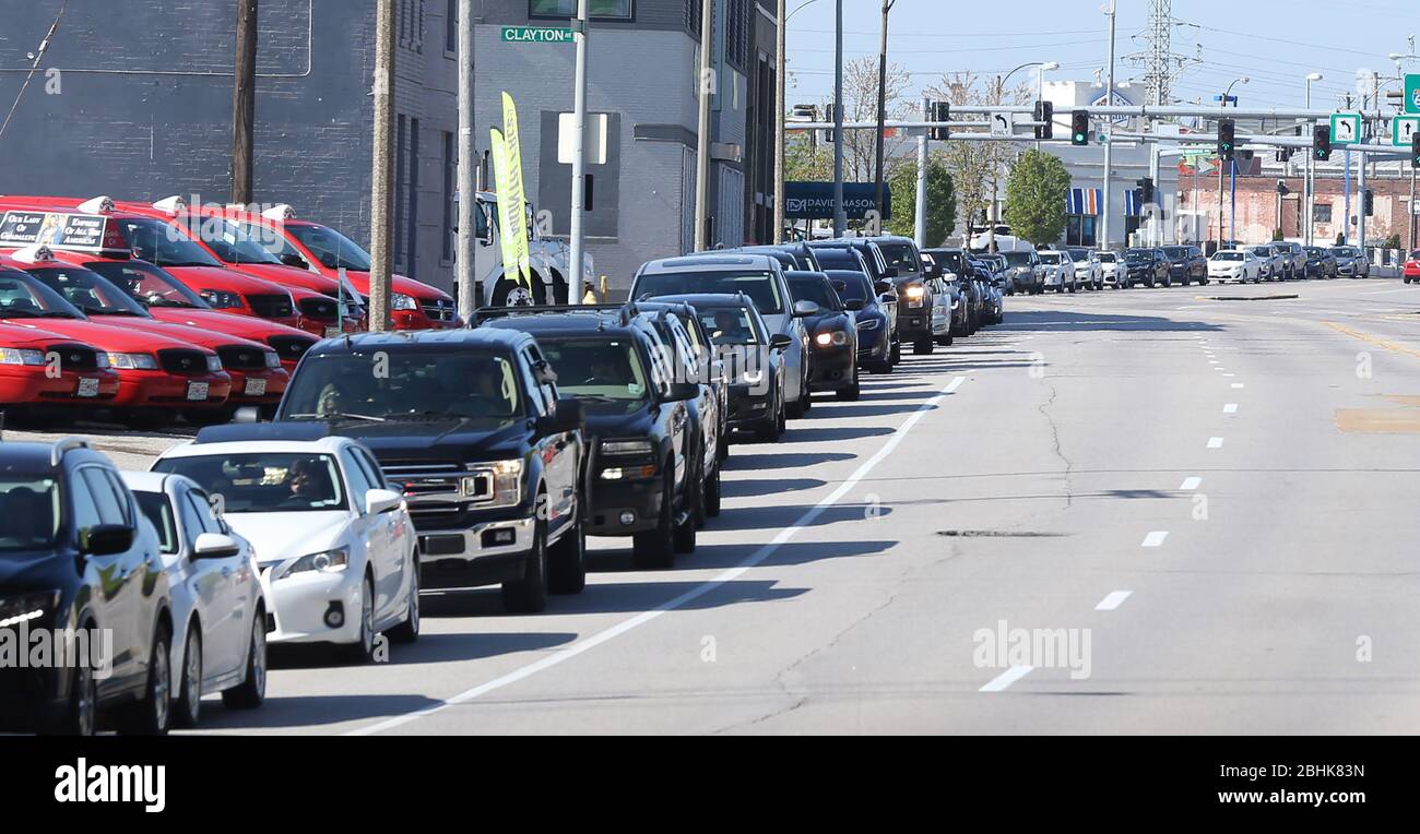 St. Louis, United States. 26th Apr, 2020. People wait in their cars for blocks for free food, in St. Louis on Sunday, April 26, 2020. Hundreds of cars lined the streets for an opportunity to receive food from several restaurants, while the group took donations for theThe Gateway Resilience Fund, an organization that assists fellow restaurant workers that are out of work because of the coronavirus. Photo by Bill Greenblatt/UPI Credit: UPI/Alamy Live News Stock Photo