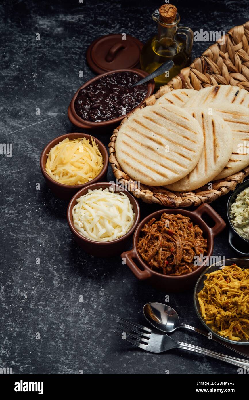 Top view of typical Latin American food. Group of arepas and different ...