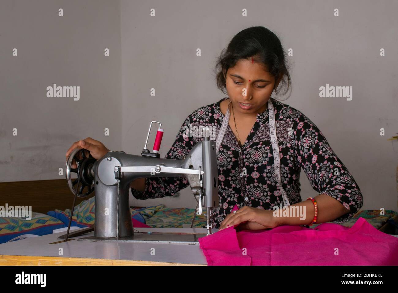 woman working on sewing machine as tailor Stock Photo Alamy