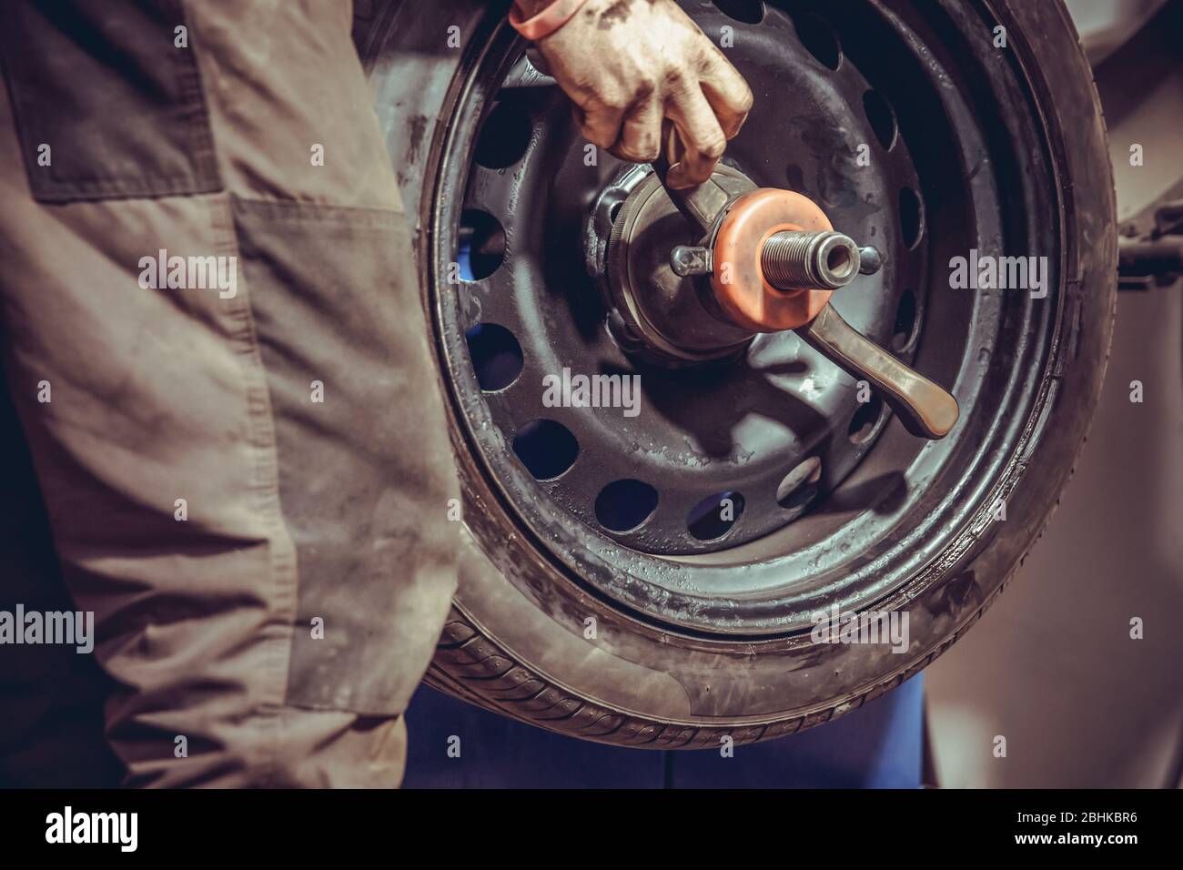 wheel balancing on special machine by adding the weights in the tire