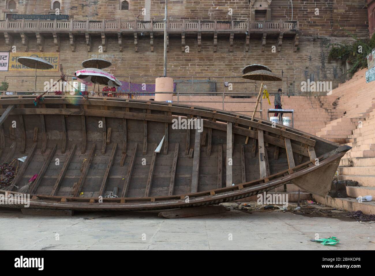 An Abstract of inner section of a transport boat in a foreground against a background of an old Historical house in Varanasi, India Stock Photo