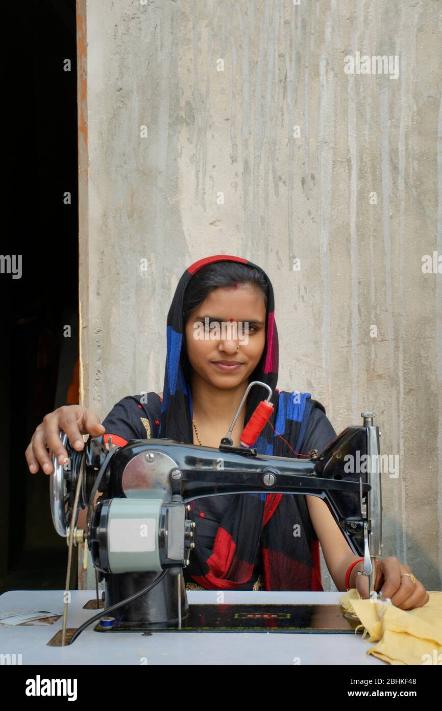 woman tailor stitching cloth using sewing machine Stock Photo Alamy