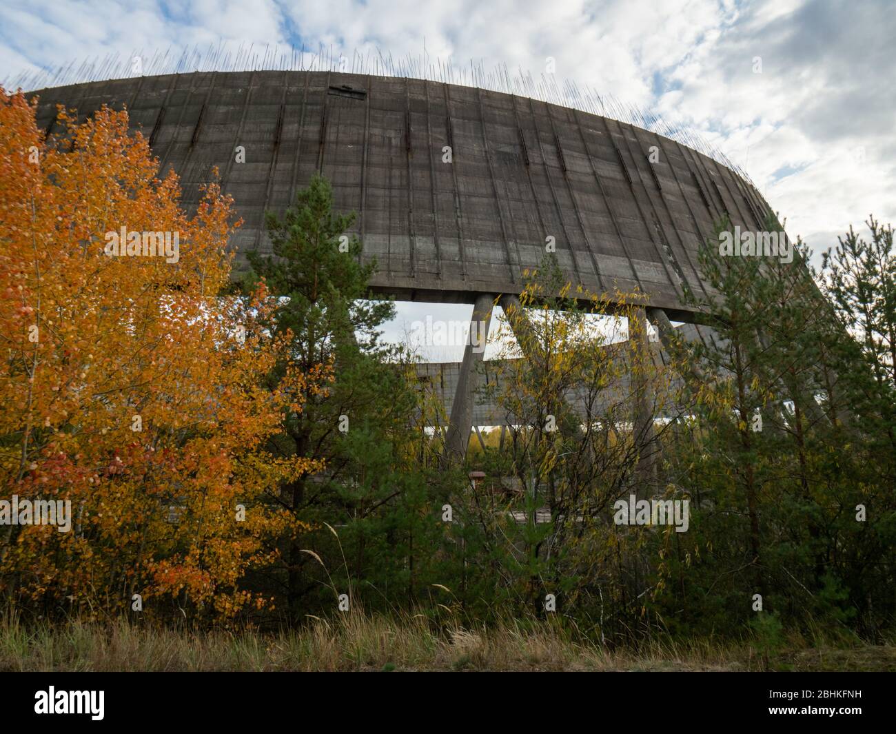 Unfinished cooling tower in Chernobyl zone at afternoon, fall season ...