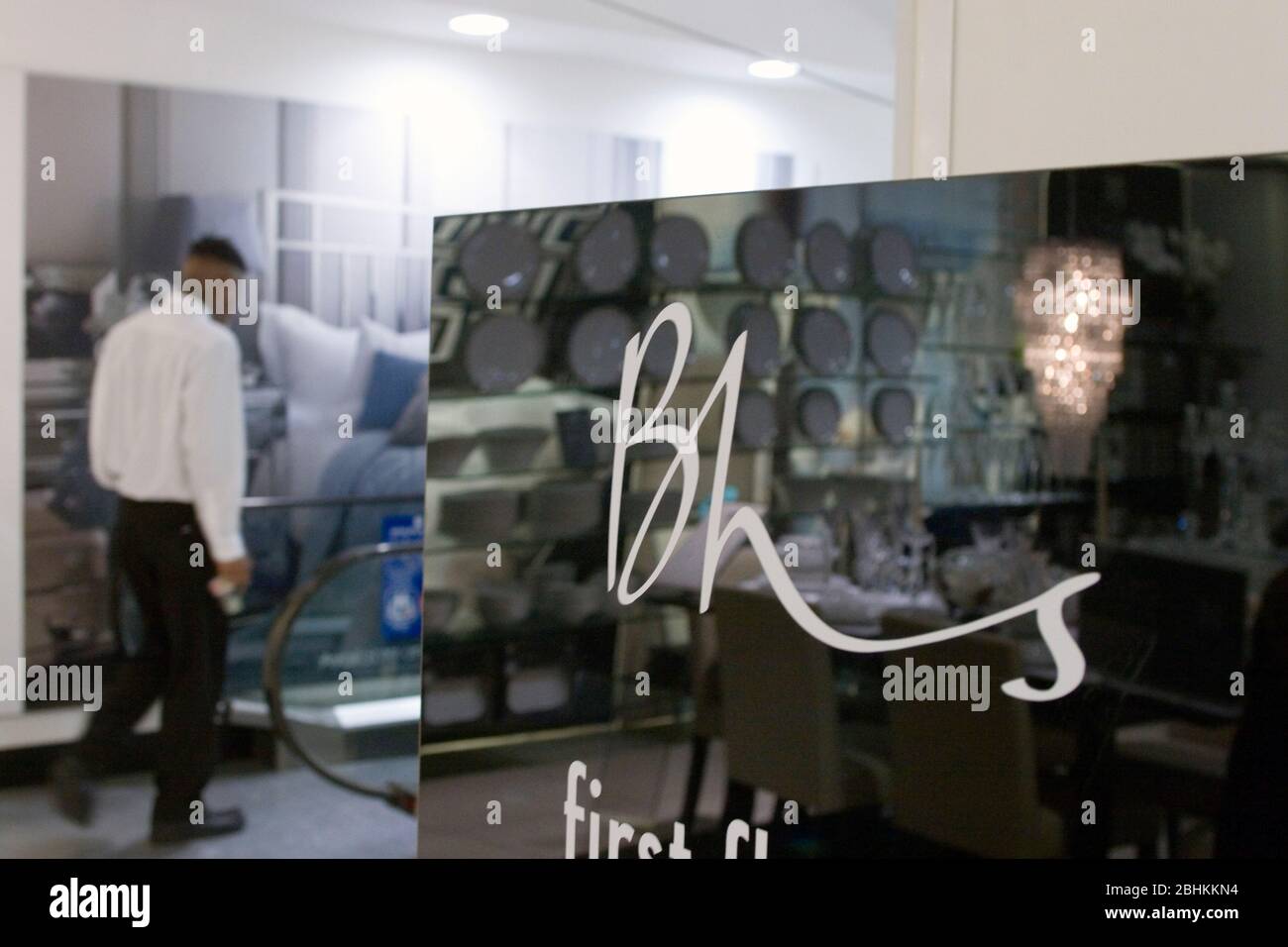 A member of staff inside the BHS store on Oxford Street, London. Stock Photo