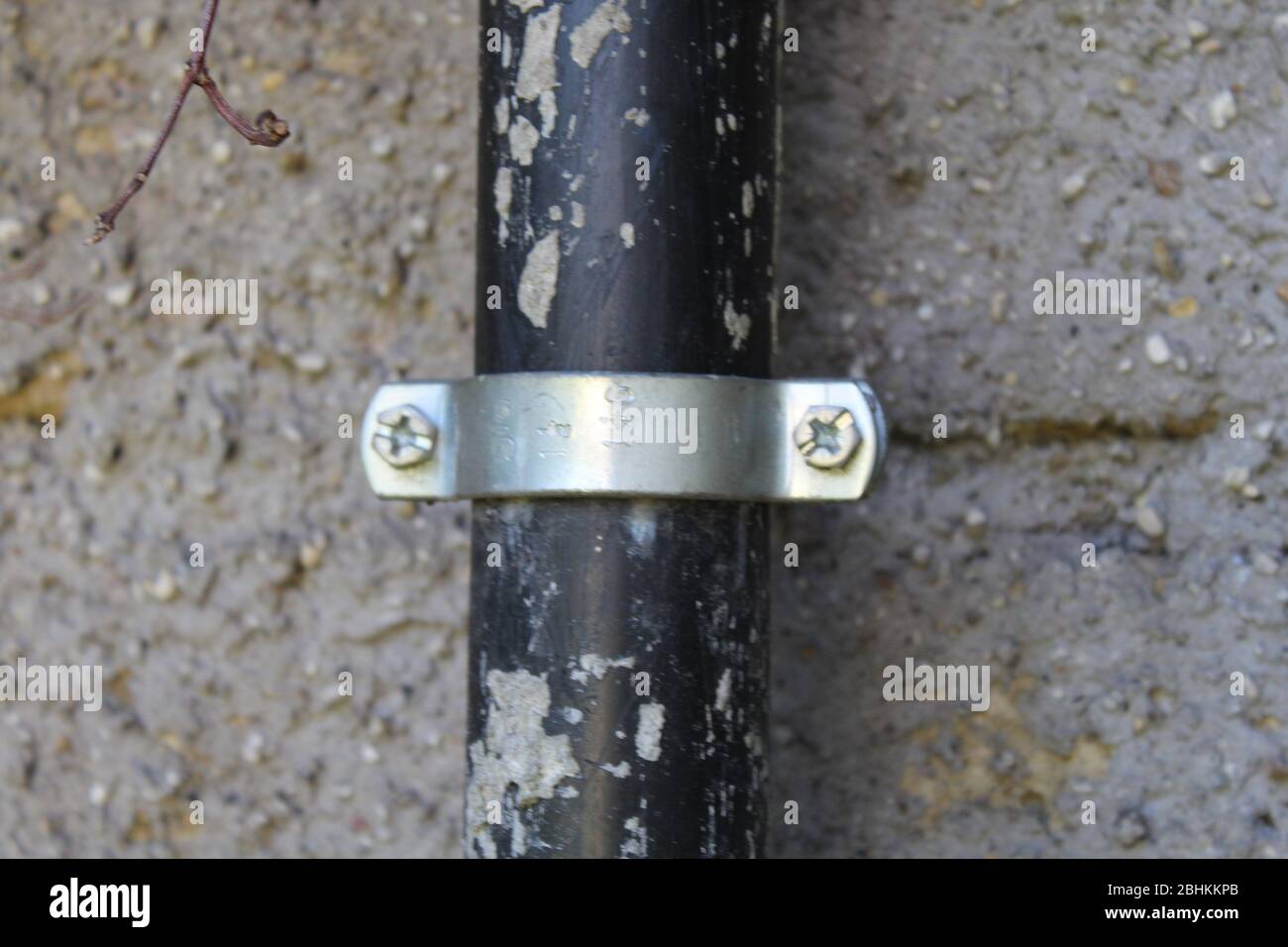 black pipe with peeling paint and metal fixture Stock Photo Alamy