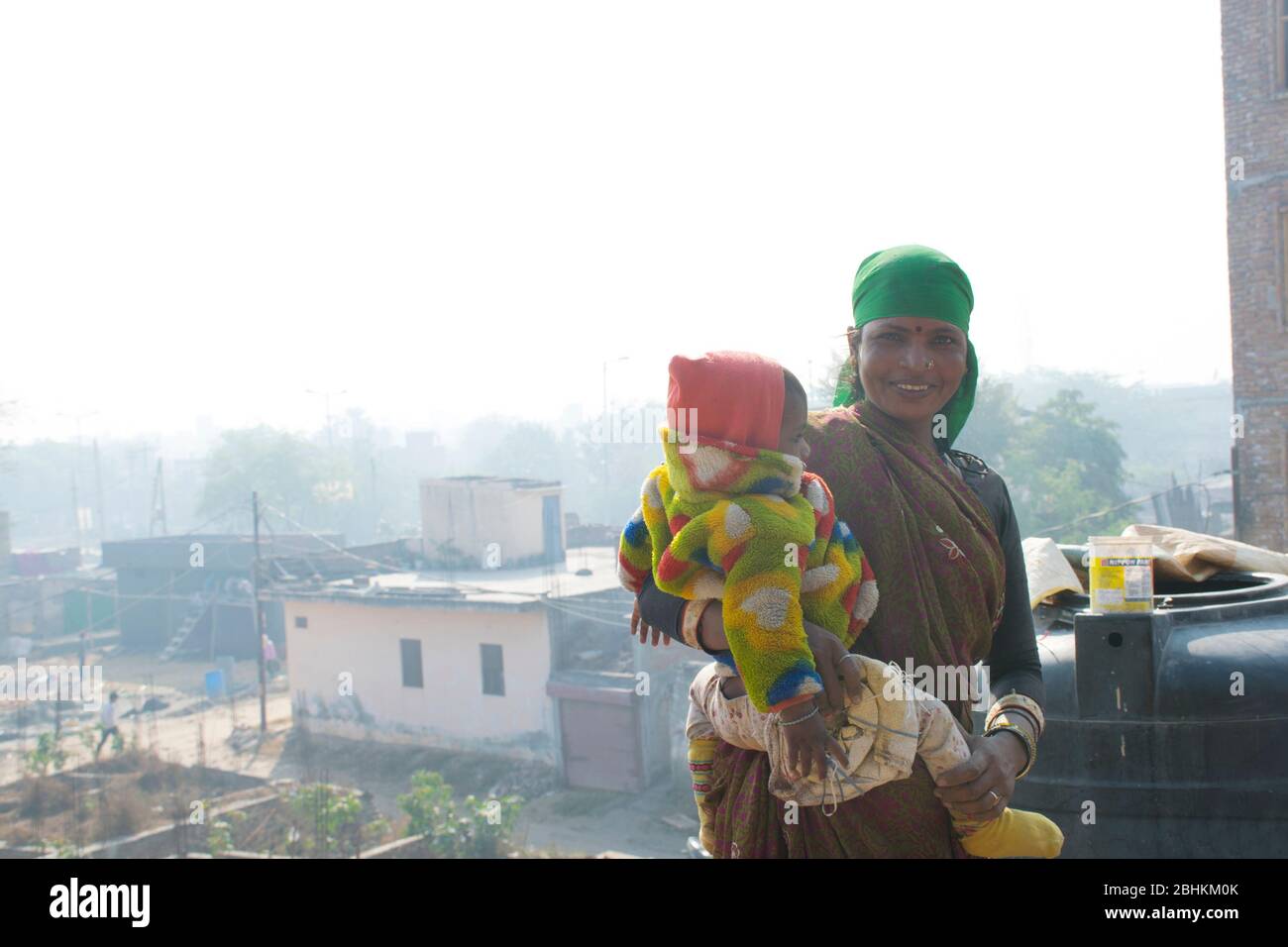 Indian rural mother and child, labourer woman holding her child Stock ...
