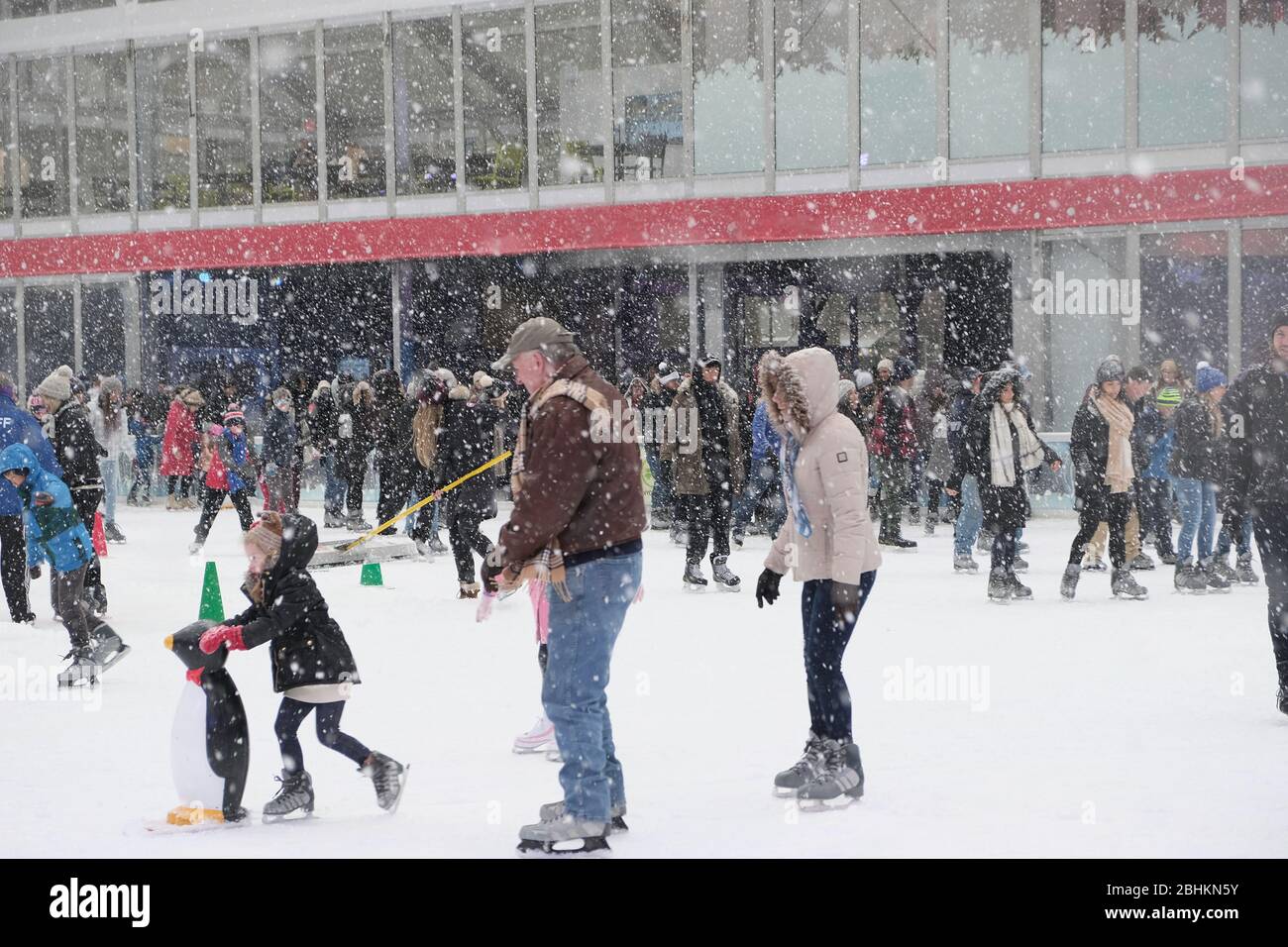 New York, NY/USA- December 2017: The ice rink at the Winter Village at Bryant Park gets very busy during the winter months with families ice skating Stock Photo