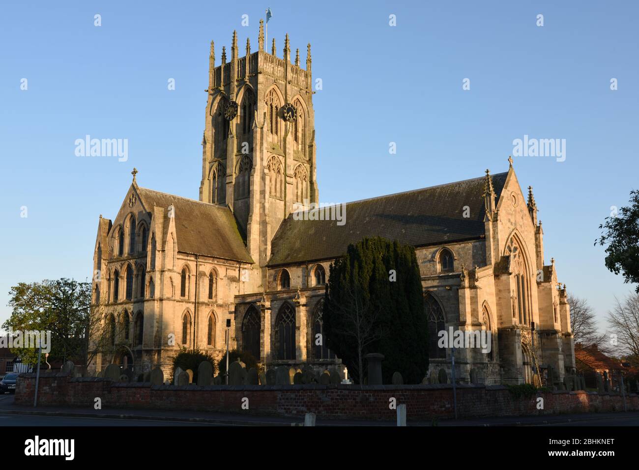 Evening sunlight illuminating St Augustine's Church, Hedon, East Yorkshire, England Stock Photo